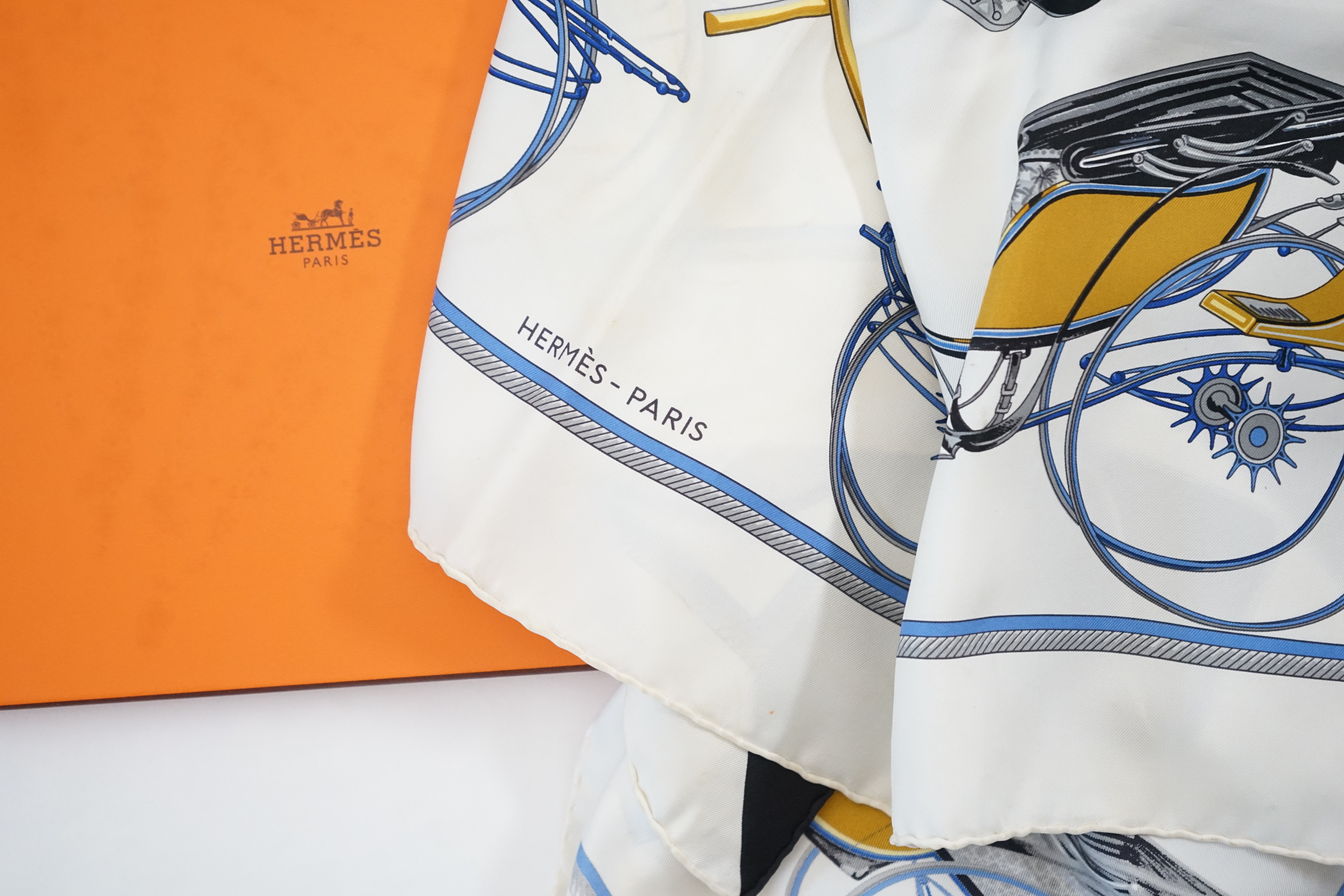 A Hermès Les Voitures a Transformation by Francoise de la Perriere black and white silk scarf, approx 90cm x 90cm